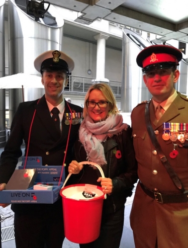 Caroline Dinenage selling poppies