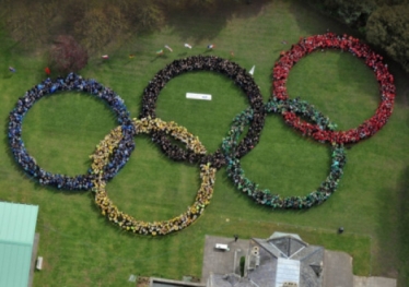 IMPRESSIVE Pupils and staff form the Olympic rings. Picture: Steve Reid